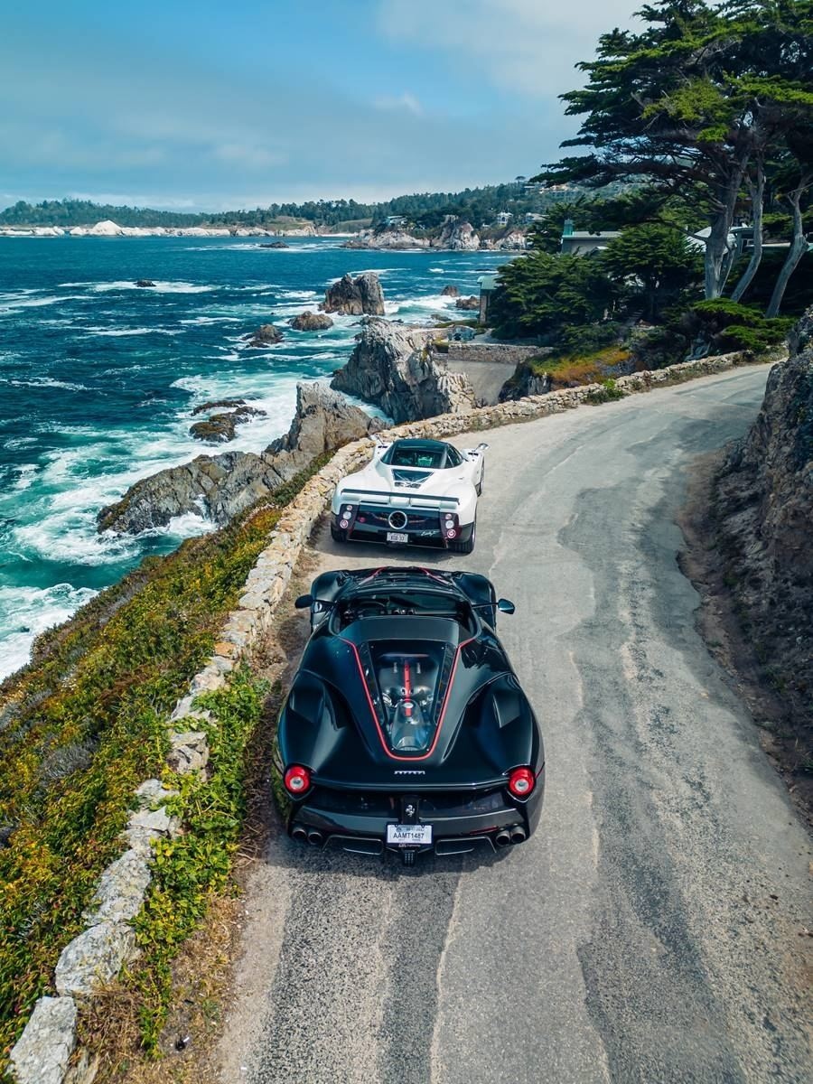 Black Ferrari LaFerrari and white Pagani Zonda photographed together above the Monterey coastline